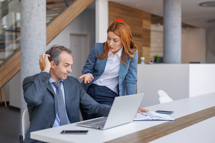 Financial advisory professionals reviewing technology issues and IT support solutions during a Microsoft 365 modernization project.
