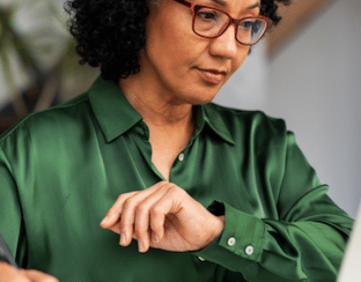 Financial advisor reviewing cybersecurity plan on laptop with secure Microsoft 365 tools