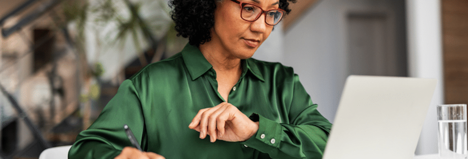 Financial advisor reviewing cybersecurity plan on laptop with secure Microsoft 365 tools