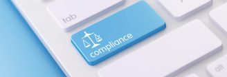 Keyboard with a compliance button, representing SEC cybersecurity enforcement and IT controls for RIAs.